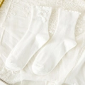 White JK style mid-calf socks with vertical ribbing, ruffle trim and bow accents - White Ribbed Ruffle Bow Style (093 White)