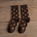 Thick wool socks in dark brown featuring vintage mushroom patterns and ribbed cuffs - One Size / All-over Mushroom