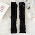 Schwarze Beinstulpen mit Zopfmuster, Satinschleife und gewelltem Saumdetail - Zopfmuster mit Schleife / Schwarz