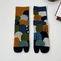 Artistic two-toe tabi socks featuring abstract forest patterns in mustard and navy knit - One Size / Tree