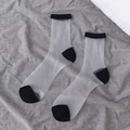 Sheer mid-calf socks featuring contrast black heels and toes in a minimalist design - Solid Black