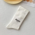 Mid-calf white cotton socks with vertical ribbed knit texture in a minimalist fold - One Size / White