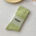 Pistachio green cotton knit mid-tube socks with vertical ribbing and paper band label - One Size / Light Green