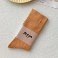 Ginger yellow cotton crew socks with vertical ribbed texture and a paper band wrap - One Size / Earth Yellow (Orange)