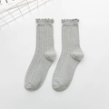 Light gray cotton blend knee-high socks featuring stylish wavy lace trim and vertical ribbing - One Size / Gray