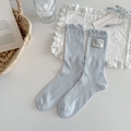 Light blue rib knit mid-calf socks with ruffle trim and Happy Smile label details - Blue