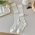 Japanese style white vertical ribbed calf socks in a minimalist flat lay arrangement - White