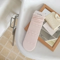Light pink knit crew socks with delicate floral texture and ruffled cuffs - One Size / Pink