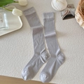 Vertical ribbed knee-high socks in light grey with elastic cuffs on a minimalist background - Light Gray