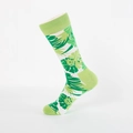 Mid-calf crew socks featuring white knit fabric with vibrant green tropical leaf patterns - Green Leaves