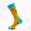 Vibrant orange cotton crew socks featuring green cactus patterns and blue contrast heels - Yellow Cactus