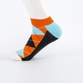 Men's low cut cotton socks featuring a colorful geometric argyle pattern in orange and blue - Orange Argyle