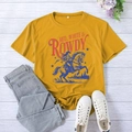 Flat lay of vintage American style t-shirt with horse rider print on mustard yellow fabric - Mustard Yellow