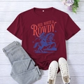 Flat lay of vintage style burgundy t-shirt with equestrian print and wood background - Burgundy