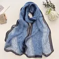 Light blue floral summer scarf for women with black flower print and sheer fabric - Linear Flower Blue