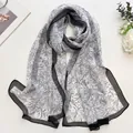 Long white chiffon scarf with elegant black hand-drawn floral patterns and wide borders - Linear Flower White