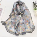 Lightweight grey summer scarf with elegant yellow floral print and red accents - Daisy Grey