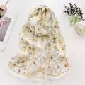 Elegant white summer scarf with small yellow daisy print and sheer fabric texture - Daisy Light Yellow