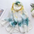 Lightweight cream silk scarf featuring lotus floral print and ink painting design - Sunlit Lotus Yellow Green