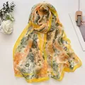 Floral lotus silk scarf in orange and dark green, perfect as a lightweight beach sarong - Pincushion Flower Yellow