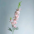 Single stem of pink faux delphinium with layered petals and green buds for home decor - Light Pink