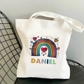 Detailed shot of white canvas tote bag featuring rainbow print and custom Daniel name - Rainbow and Heart Custom Name Style(18)