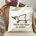 Detail of white canvas tote bag featuring a funny goose print and internal floral accents - Funny Goose with Knife Style(16)