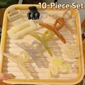 Top view of 10-piece hair clip set including claw clips and floral designs on a tray - 10 Pcs Hair Clips Combo Set / 10Pcs