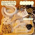 Detail of 111-piece plush hair accessory set in beige and brown colors with hair ties - 111 Pcs Winter Hair Accessory Set / 111 Pieces/Pack