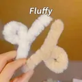 Detail of plush faux fur claw clips in white and beige for cozy winter hair styling - Coffee Plush Cross Hair Claw
