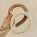 Detail of plush faux fur headbands in dark coffee and cream white for winter styling - Creamy White Plush Winter Headband