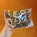 Detail view of 100 high elastic hair bands in assorted neutral coffee tones and colors - Thickened High Elastic Hair Ties / 100 Pieces Set