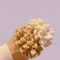 Close-up of plush cream and brown scrunchies showing soft textured fabric and fluffy design - Creamy White Plush Hair Scrunchie