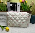 Quilted off-white cosmetic bag with pink bow pattern and diamond stitching detail - Medium Makeup Bag (White Background Pink Bow)