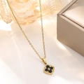 Macro detail of 18K gold-plated clover pendant with vintage brushed metal texture - Black Vintage Clover Necklace (835)