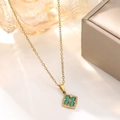 Detailed close-up of a vintage clover necklace with malachite inlay and golden flower - Green Vintage Clover Necklace (838)