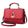 Red quilted faux leather handbag with golden teardrop lock and round top handle - Burgundy