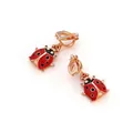 Close-up of red enamel ladybug clip-on earrings with rose gold plating and small rhinestones - Ear Clip Style (E4218) / Red