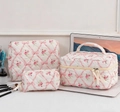 Three-piece quilted cotton floral makeup bag set with pink bow pattern and ribbon - Pink Bow Floral / Large Cosmetic Bag