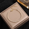 Elegant 4mm gold tennis bracelet with shimmering cubic zirconia on premium jewelry box - Gold