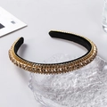 Detailed macro view of champagne rhinestones on a golden multilayer baroque headband - Champagne Rhinestone