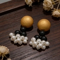 2603227 Black And Gold Wood-trimmed Pearl Tassel Earrings