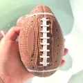 Mini American football squeeze toy with textured surface for water play and stress relief - Bath American Football Ball