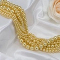 Champagne gold faux pearl strand with mixed bead sizes on elegant white silk fabric - 296 Gold (no. 20) / Approximately 200 Pieces Per Strip 4mm In Size.