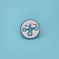 Round enamel pin featuring tRNA structure and Be Lucky text on a light blue background - Round tRNA Be Lucky