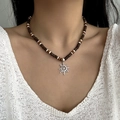 Bohemian beaded necklace with silver sun pendant and coconut wood beads on a model - Wood Bead Sun Double Layer Necklace