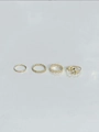 Detailed view of four-piece gold bohemian ring set with hollow star and olive leaf motifs - Star Leaf Twist Rope Style (5)