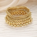 7-piece set of gold beaded elastic bracelets featuring assorted bead sizes and polished finish - Western Fashion Beaded Style (6314901HB)