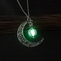 Luminous silver hollow moon pendant necklace with glowing green bead on dark background - Yellow-Green Luminous Moon Pumpkin (NY354)