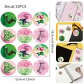 Detail of 10PCS witch-themed birthday stickers featuring castles and hats in pink and green - Witch - Round Decoration Stickers (10 Pcs)